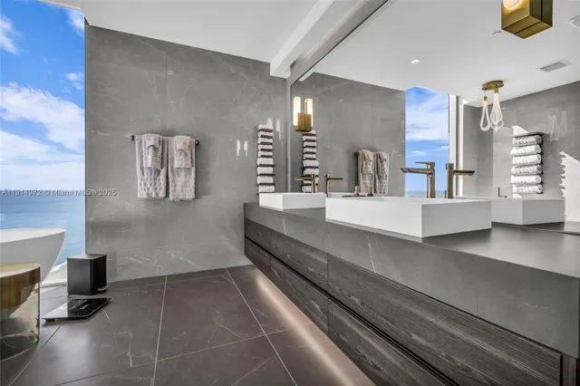 a kitchen with granite countertop a sink and cabinets