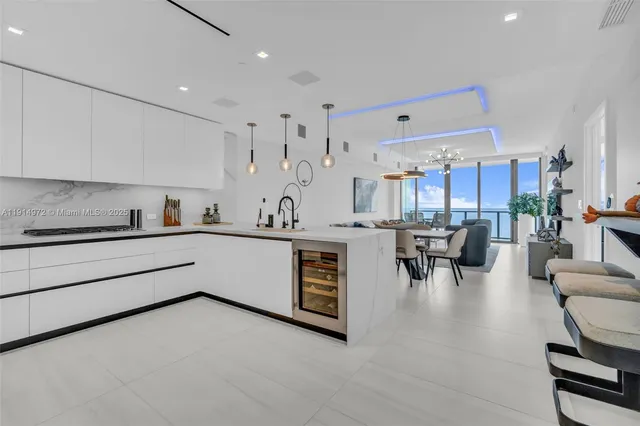 a kitchen with stainless steel appliances granite countertop a sink and cabinets