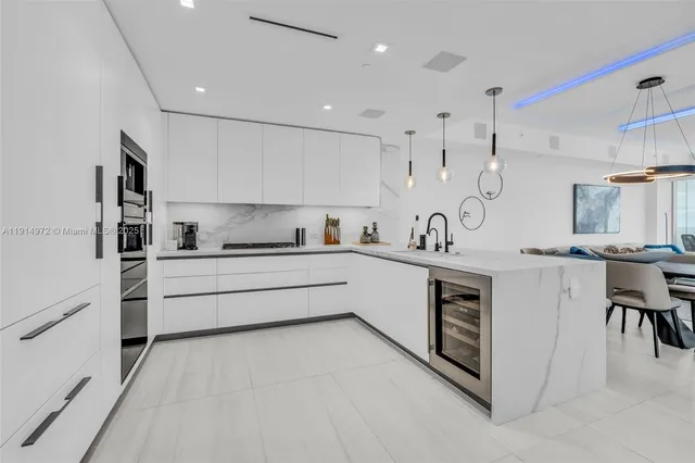 a kitchen with counter top space and cabinets