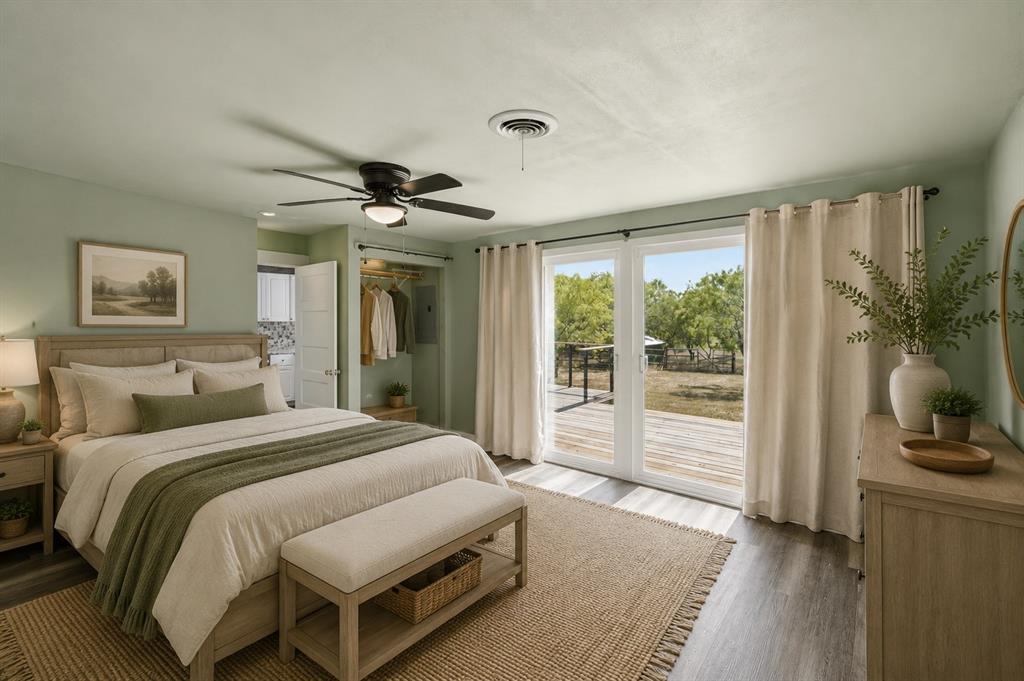 3325 Dove Creek Road Cleburne, TX 76031 - Photo 7 of 40 Spacious bedroom featuring light wood-finish flooring and a ceiling fan
