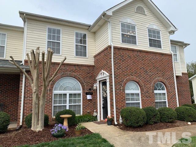 2111 Piney Brook Road, Unit 107 Raleigh, NC 27614 - Photo 1 of 23 a front view of a house with garden