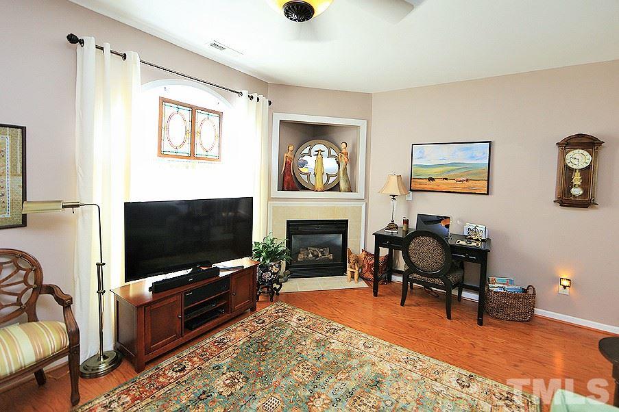 2111 Piney Brook Road, Unit 107 Raleigh, NC 27614 - Photo 23 of 23 a living room with furniture and a flat screen tv