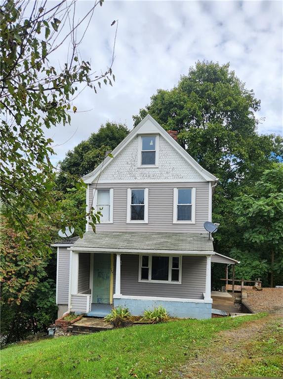 604 North 10th Street Apollo, PA 15613 - Photo 1 of 10 a front view of a house with garden