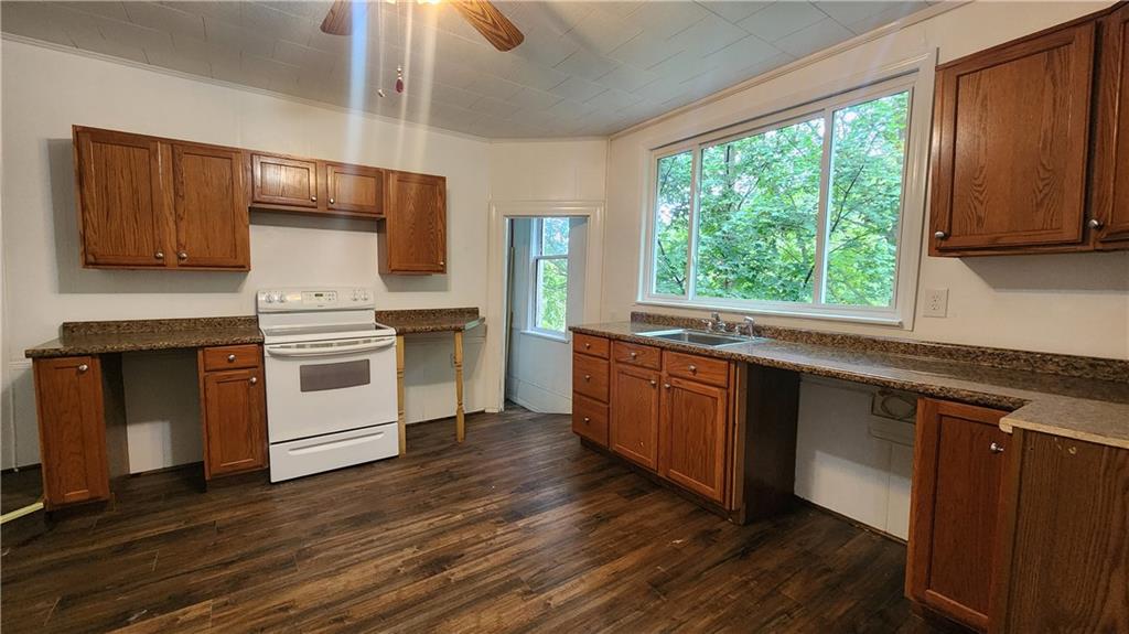 604 North 10th Street Apollo, PA 15613 - Photo 3 of 10 a kitchen with wooden floors and white stainless steel appliances