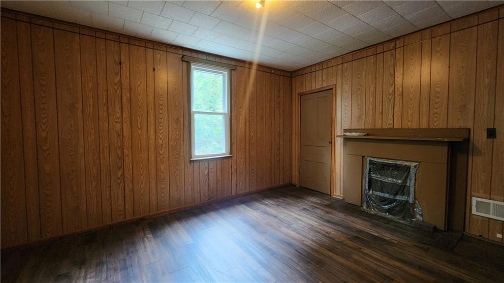 604 North 10th Street Apollo, PA 15613 - Photo 8 of 10 a view of an empty room with wooden floor and a window