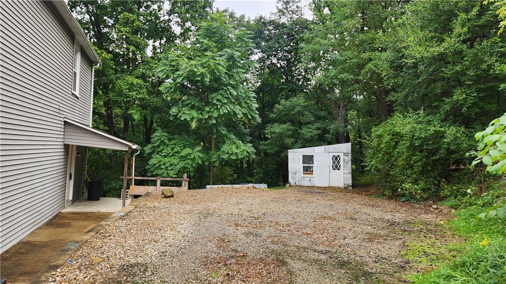 604 North 10th Street Apollo, PA 15613 - Photo 10 of 10 a backyard of a house with barbeque oven and trees