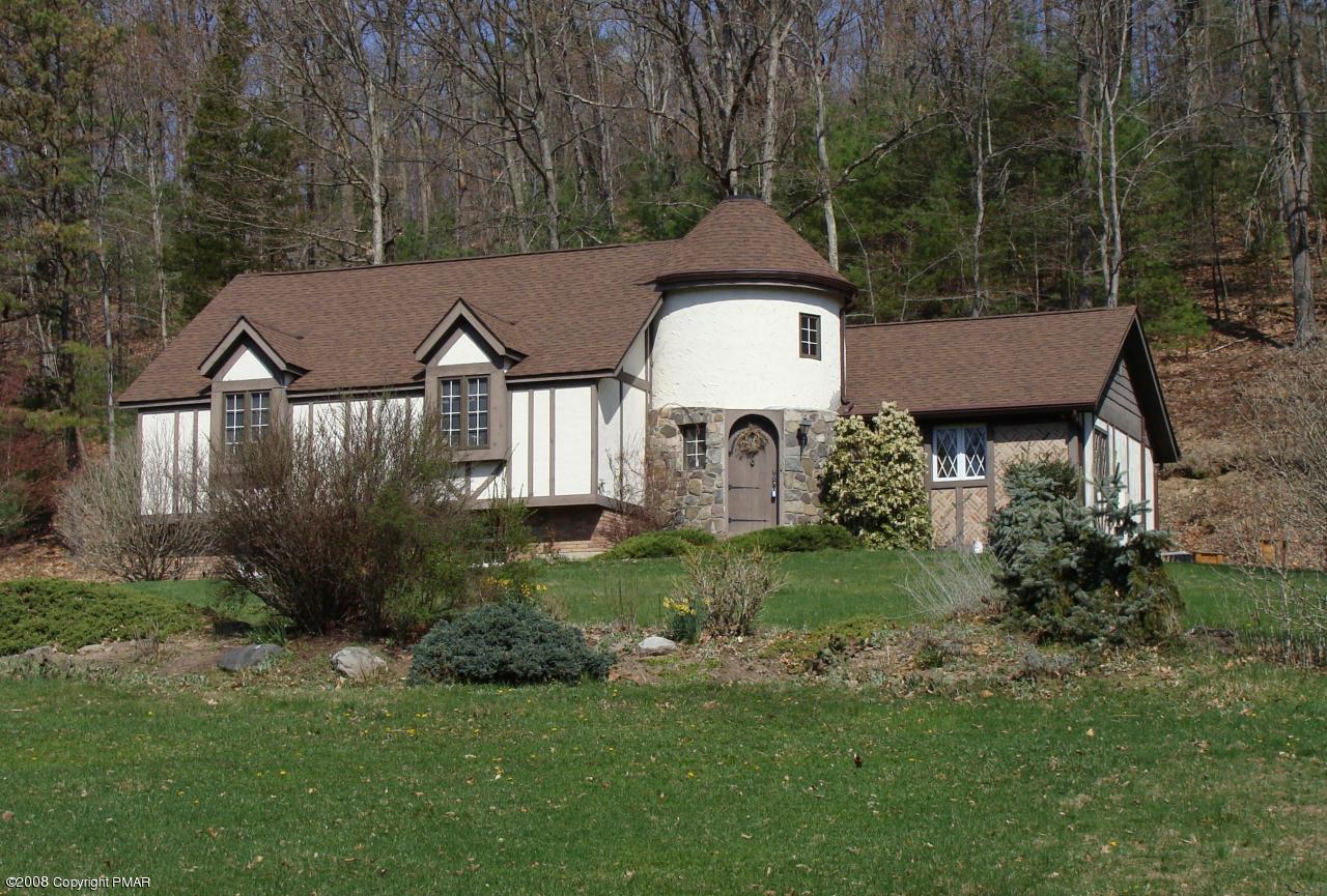 1110 Kroucher Road Stroudsburg, PA 18360 - Photo 1 of 19 a front view of a house with a yard and trees