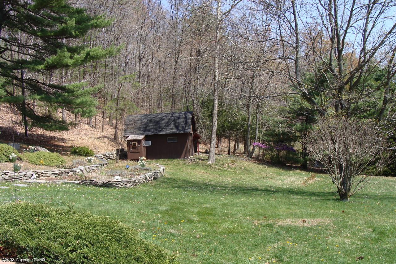 1110 Kroucher Road Stroudsburg, PA 18360 - Photo 17 of 19 a backyard of a house with yard and trampoline