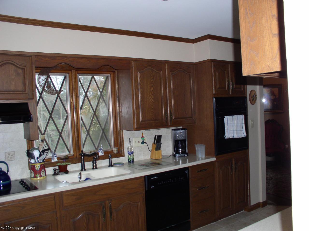 1110 Kroucher Road Stroudsburg, PA 18360 - Photo 5 of 19 a kitchen with a sink cabinets and a window