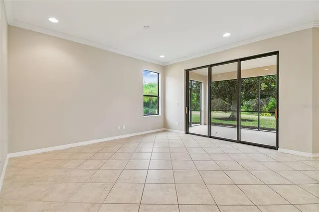 a view of a kitchen with an empty space and a window