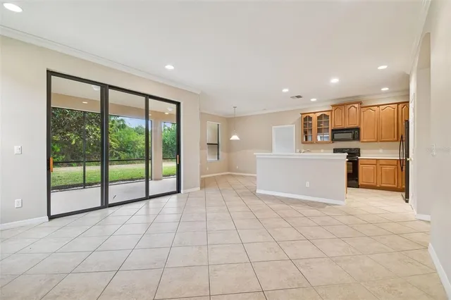 a view of a kitchen with a sink and a refrigerator