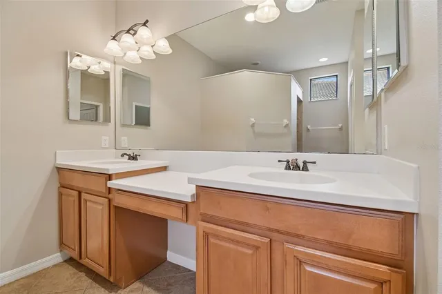 an aerial view of a house with a garden and lake view