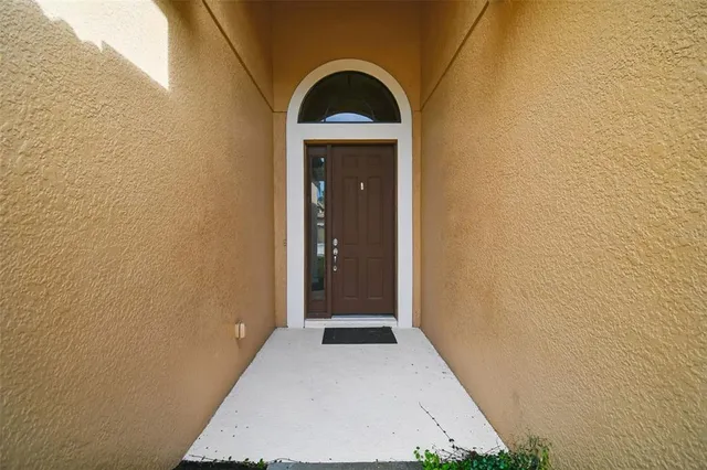 a view of a livingroom with wooden floor and a sink