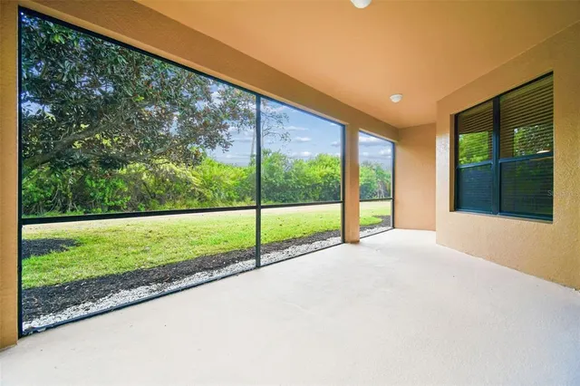 a view of a lake with outdoor seating and yard
