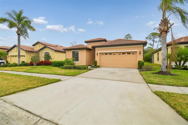 an aerial view of a house with yard swimming pool and outdoor seating