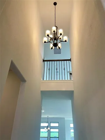 a kitchen with a white appliances and cabinets