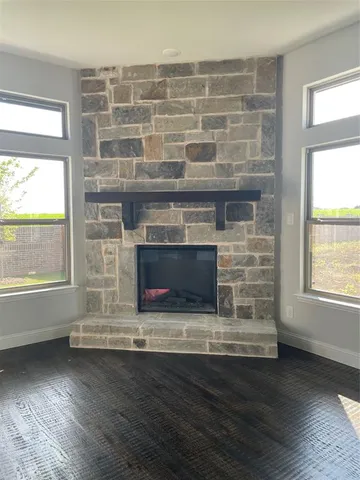 a bathroom with a tub a sink a window and a shower