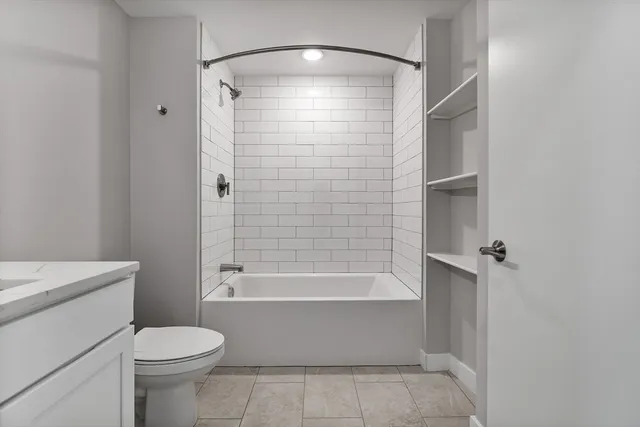 a bathroom with a shower and a toilet