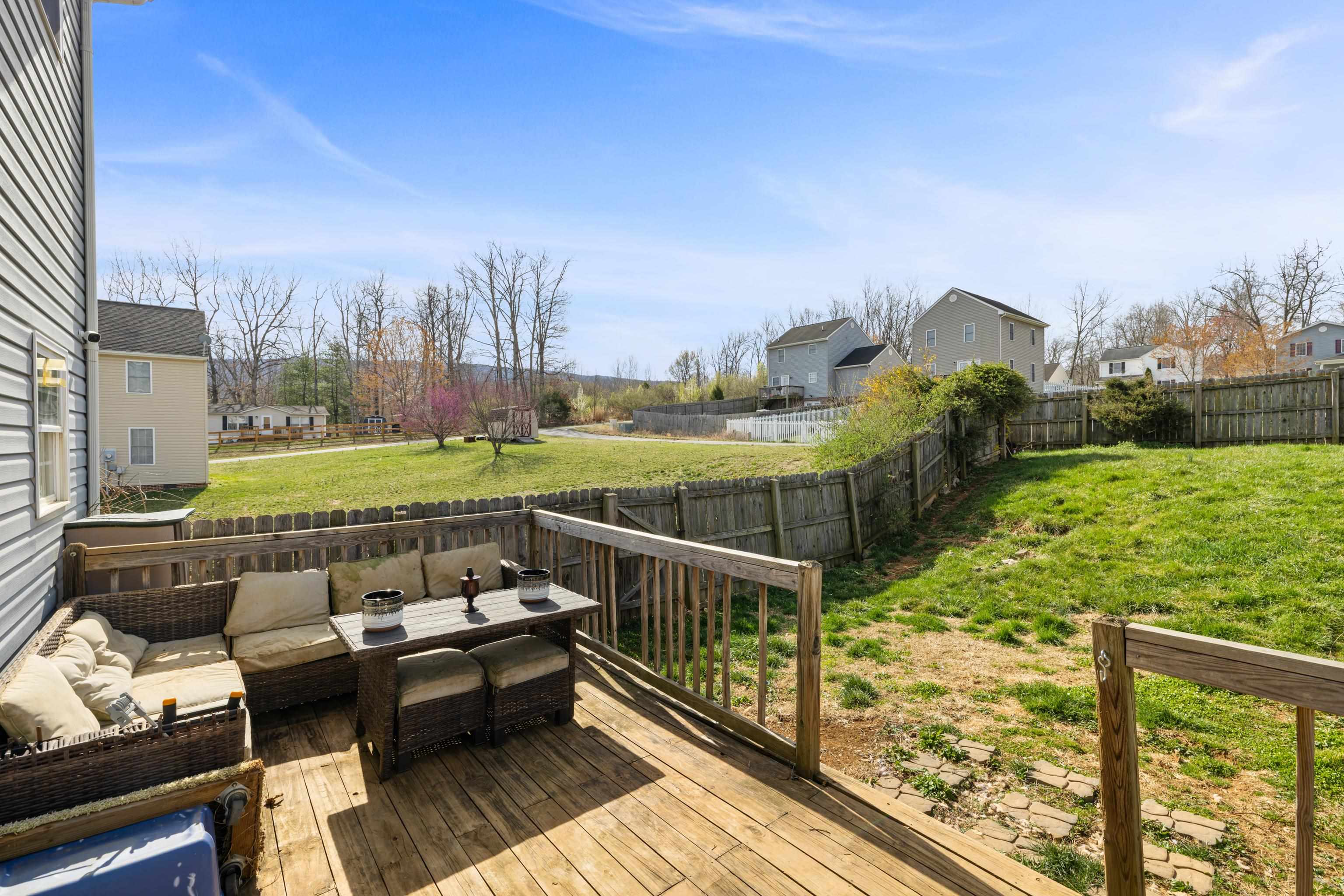 1520 3rd Street Waynesboro, VA 22980 - Photo 36 of 55 a view of a balcony with two chairs and a yard