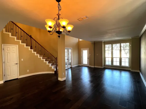 a view of an entryway with wooden floor