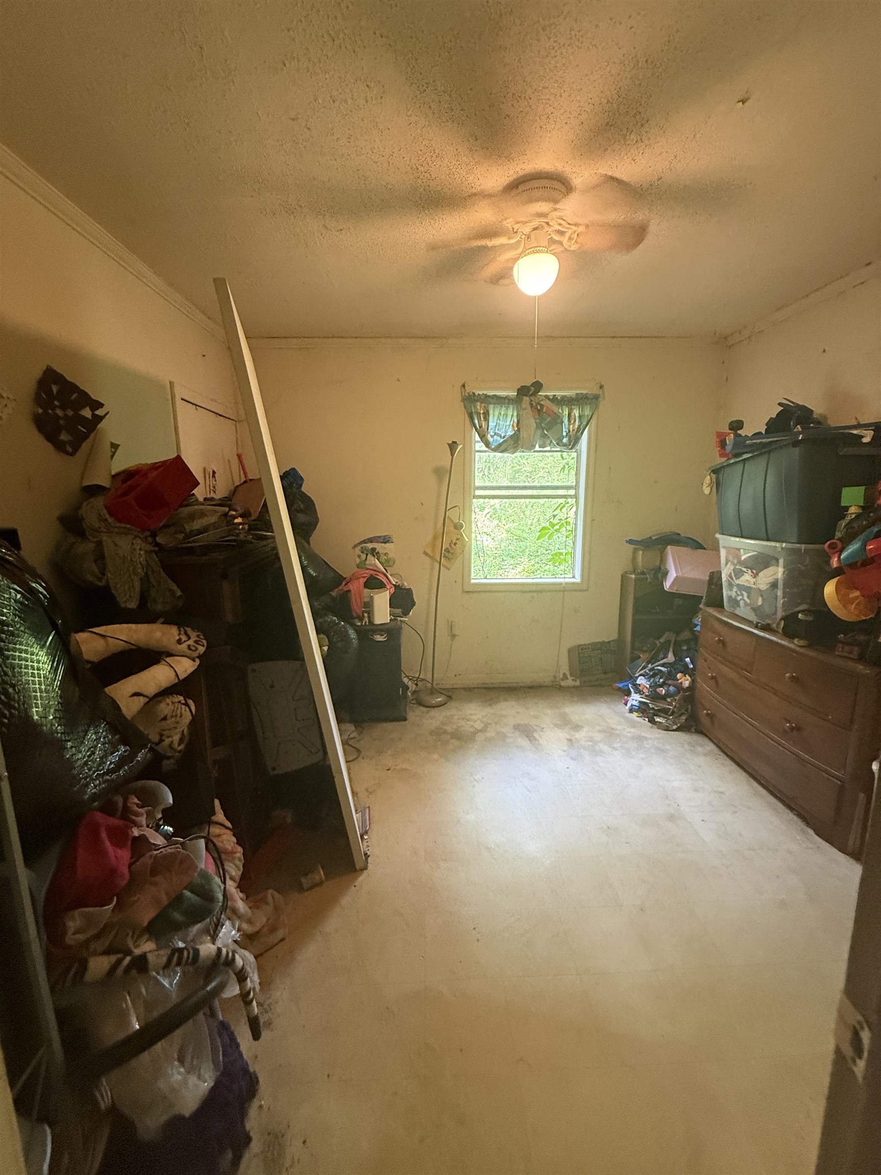 5085 Clinton Road Memphis, TN 38109 - Photo 21 of 36 Bedroom featuring a textured ceiling and a ceiling fan