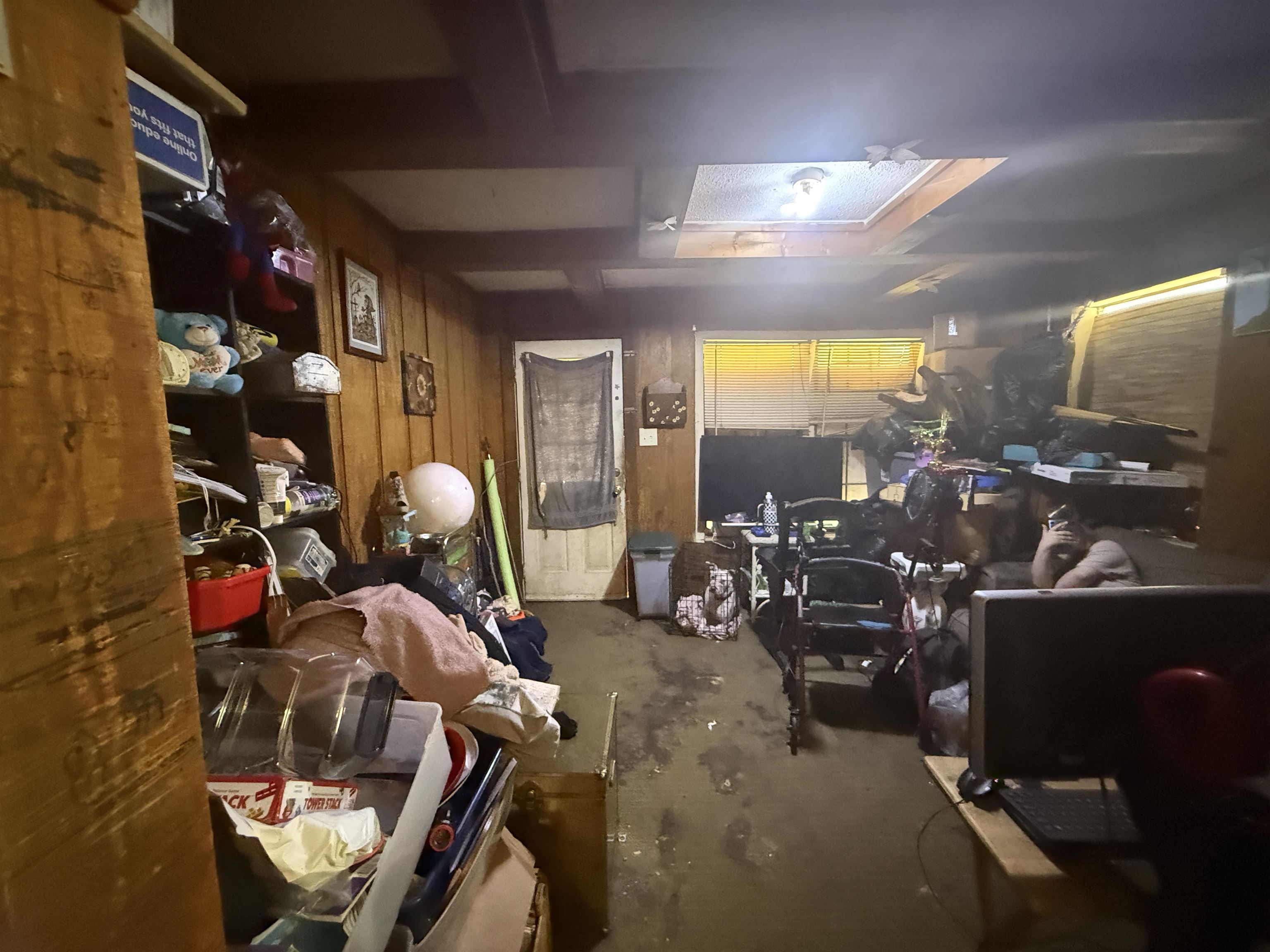 5085 Clinton Road Memphis, TN 38109 - Photo 32 of 36 Miscellaneous room with wooden walls and unfinished concrete floors