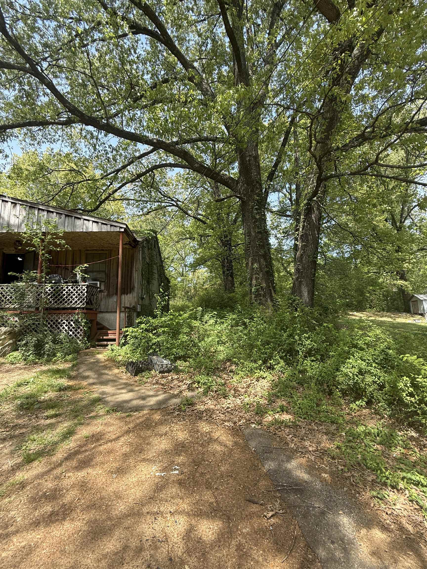 5085 Clinton Road Memphis, TN 38109 - Photo 4 of 36 View of yard featuring a wooden deck