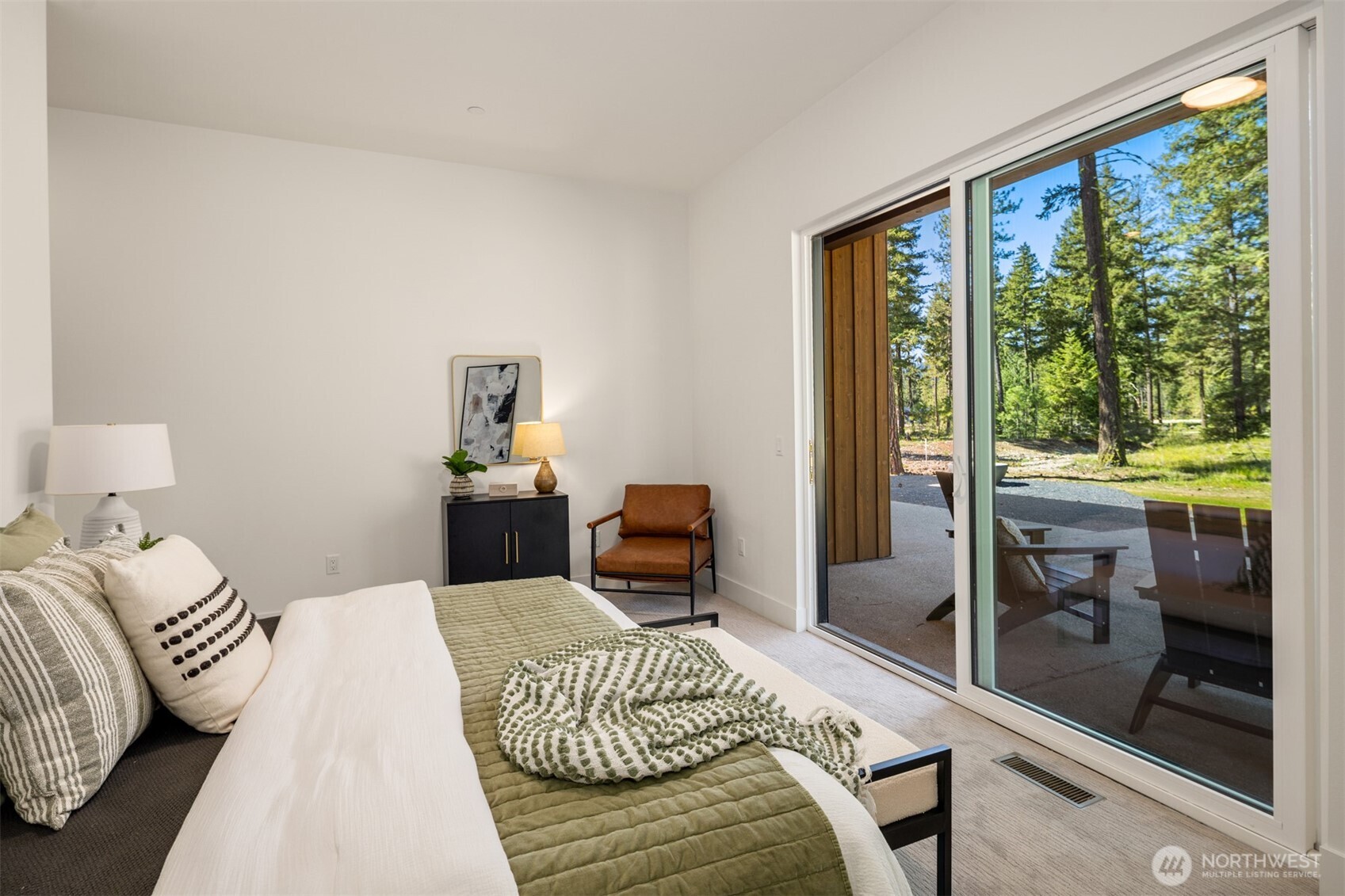 2010 Wanawish Loop Ronald, WA 98940 - Photo 15 of 28 a bedroom with a bed and wooden floor