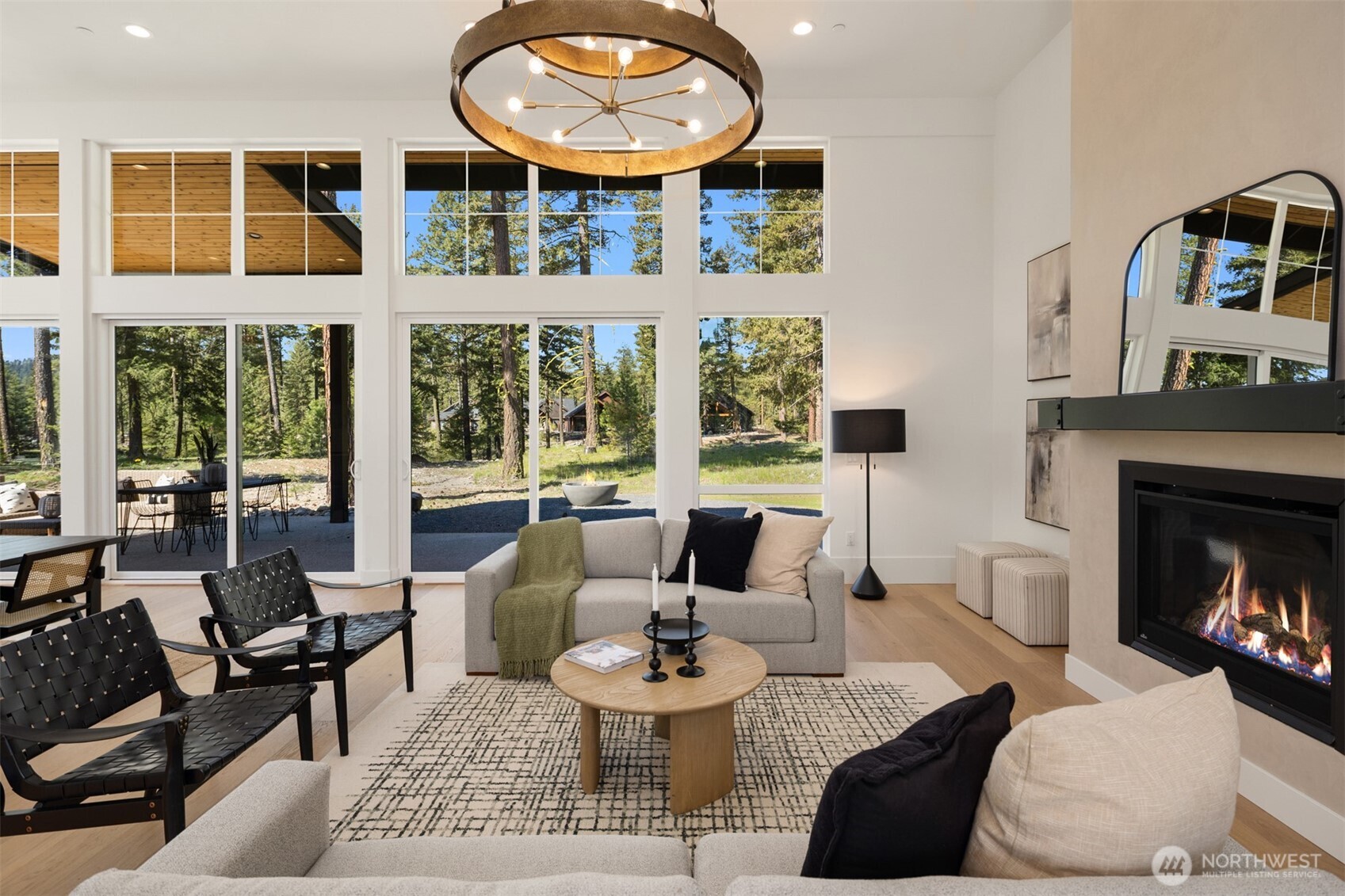 2010 Wanawish Loop Ronald, WA 98940 - Photo 5 of 28 a living room with furniture a fireplace and a floor to ceiling window