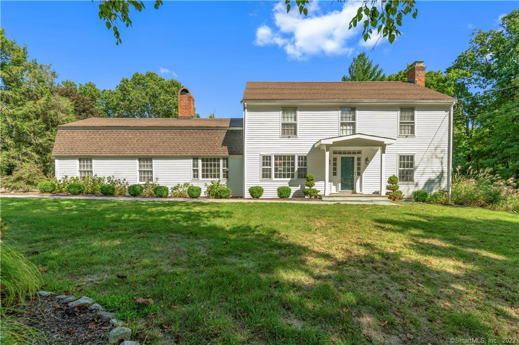 1992 Redding Road Fairfield, CT 06824 - Photo 1 of 1 a front view of a house with a yard