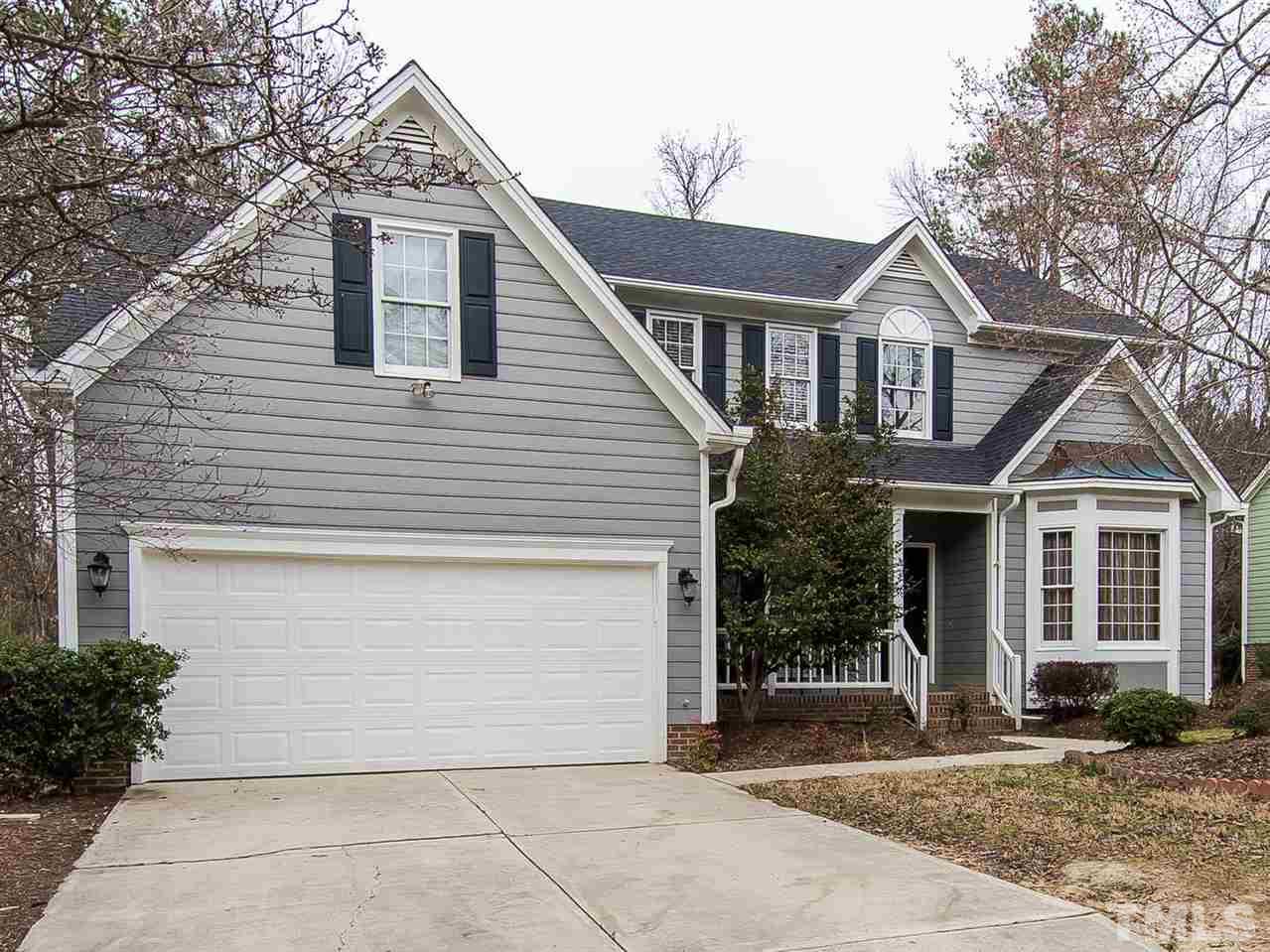 5424 Stewartby Drive Raleigh, NC 27613 - Photo 1 of 25 a front view of a house with garden