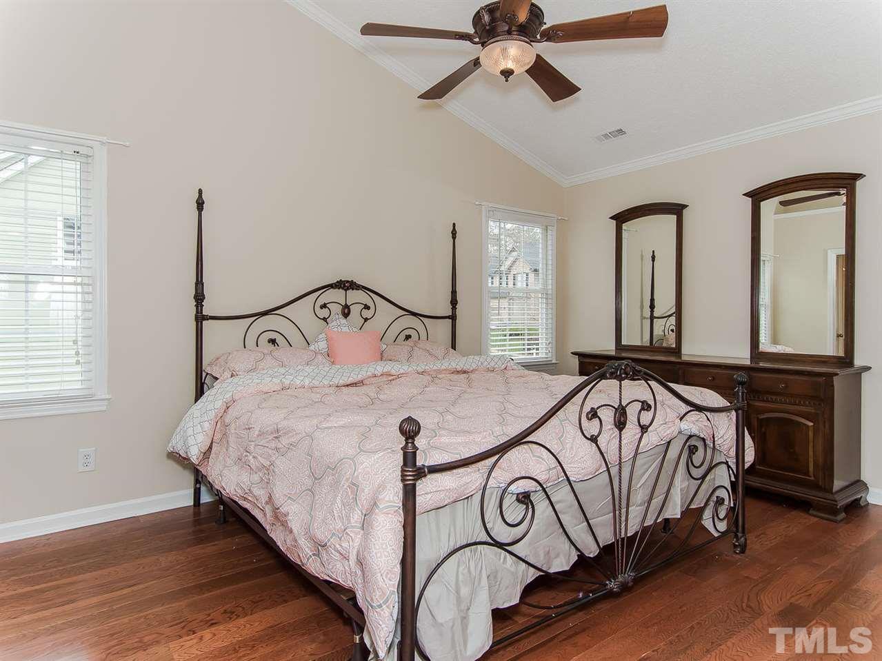 5424 Stewartby Drive Raleigh, NC 27613 - Photo 14 of 25 a bedroom with a bed and window