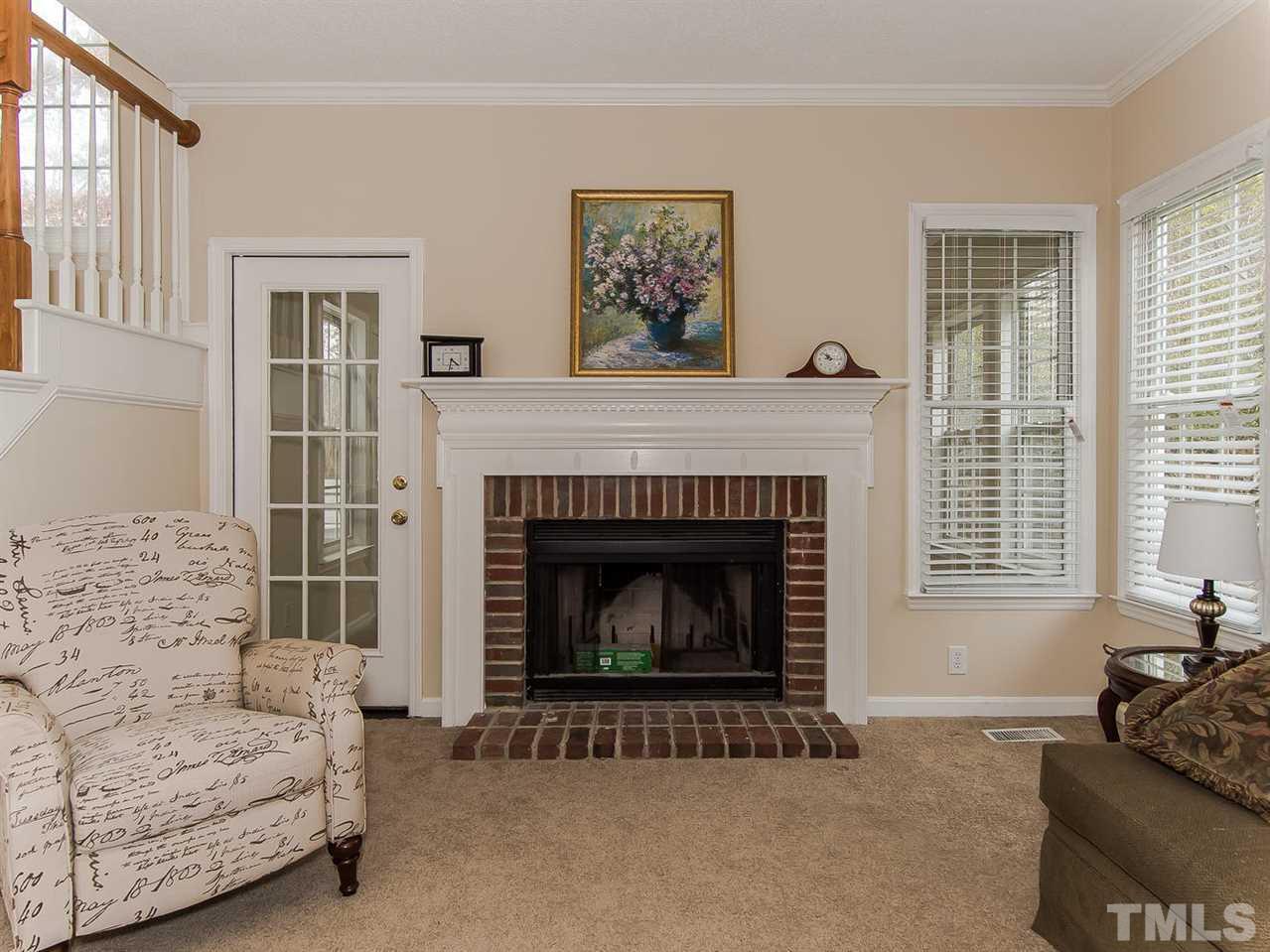 5424 Stewartby Drive Raleigh, NC 27613 - Photo 3 of 25 a living room with furniture and a fireplace