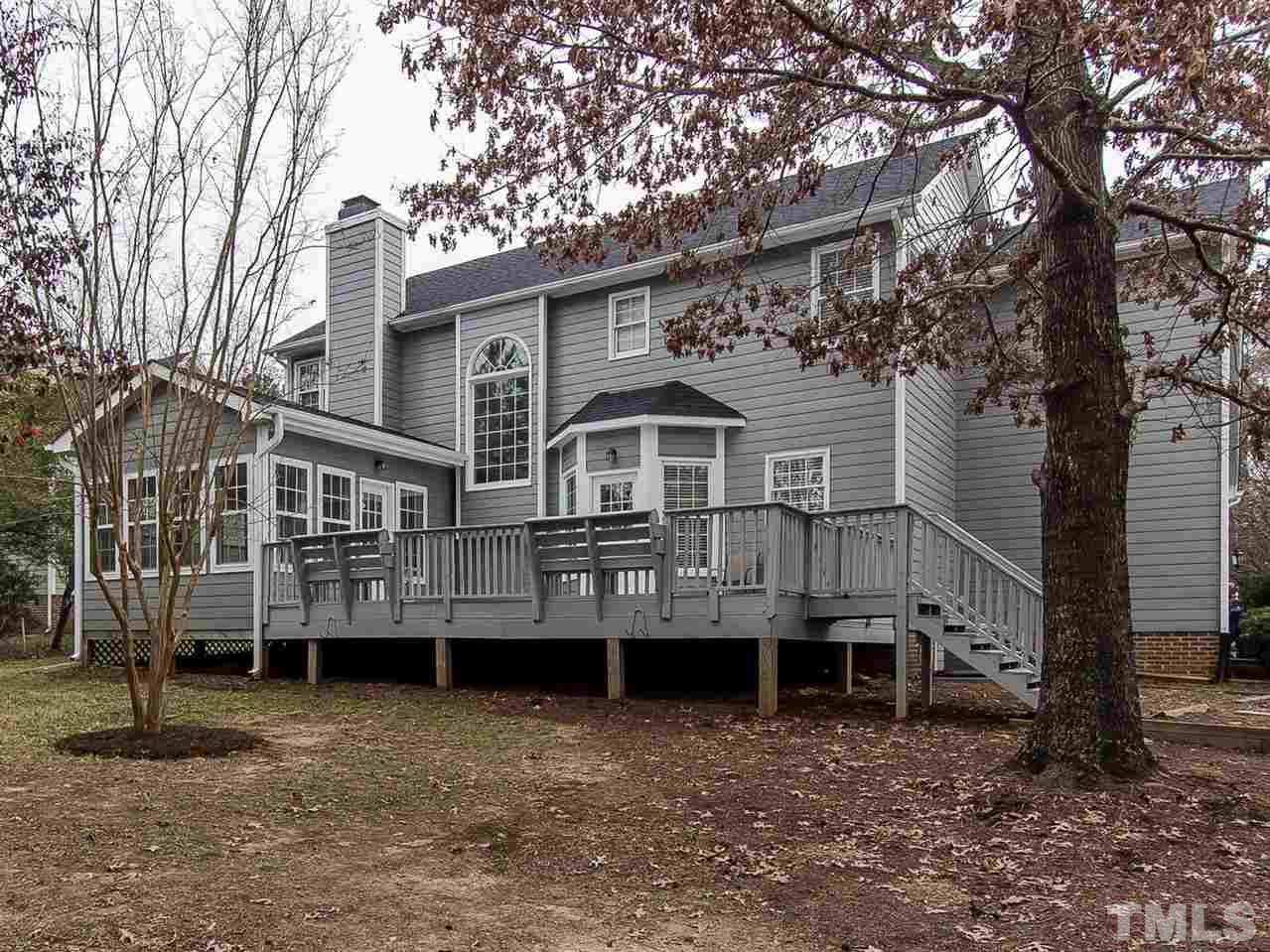 5424 Stewartby Drive Raleigh, NC 27613 - Photo 24 of 25 a view of a house with a yard