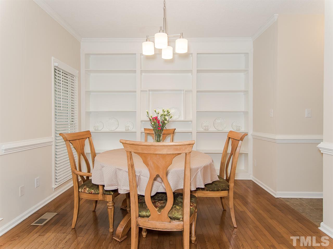 5424 Stewartby Drive Raleigh, NC 27613 - Photo 6 of 25 a view of a dining room with furniture and wooden floor