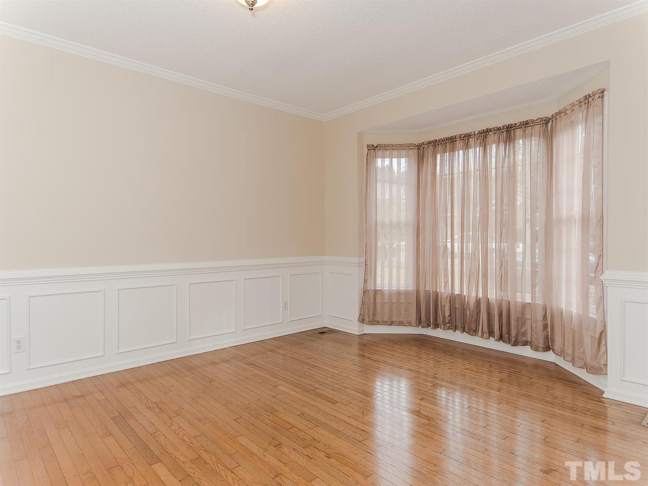 5424 Stewartby Drive Raleigh, NC 27613 - Photo 8 of 25 wooden floor in an empty room with a window