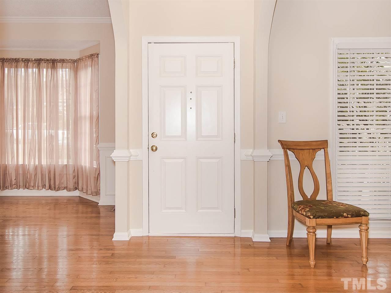 5424 Stewartby Drive Raleigh, NC 27613 - Photo 10 of 25 an empty room with wooden floor and a window