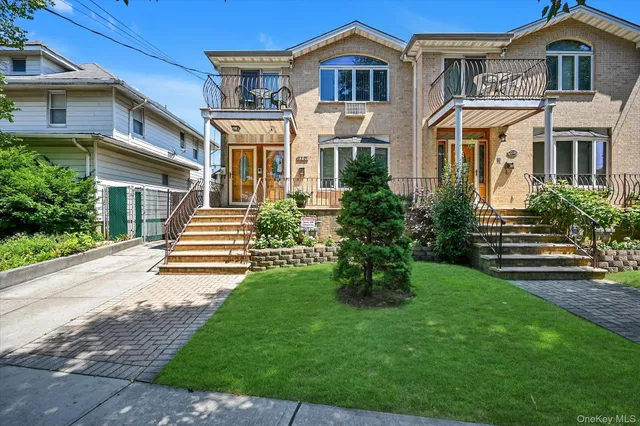 a front view of a house with a garden