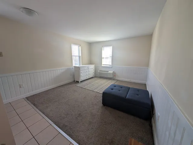 a living room with a couch and a window