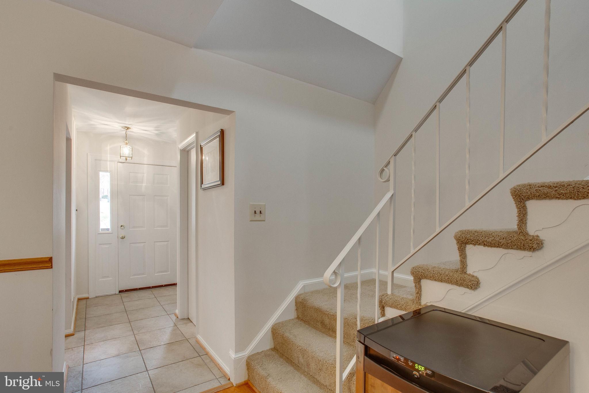 7416 Spring Tree Drive Springfield, VA 22153 - Photo 8 of 53 Stairway leads to upper level