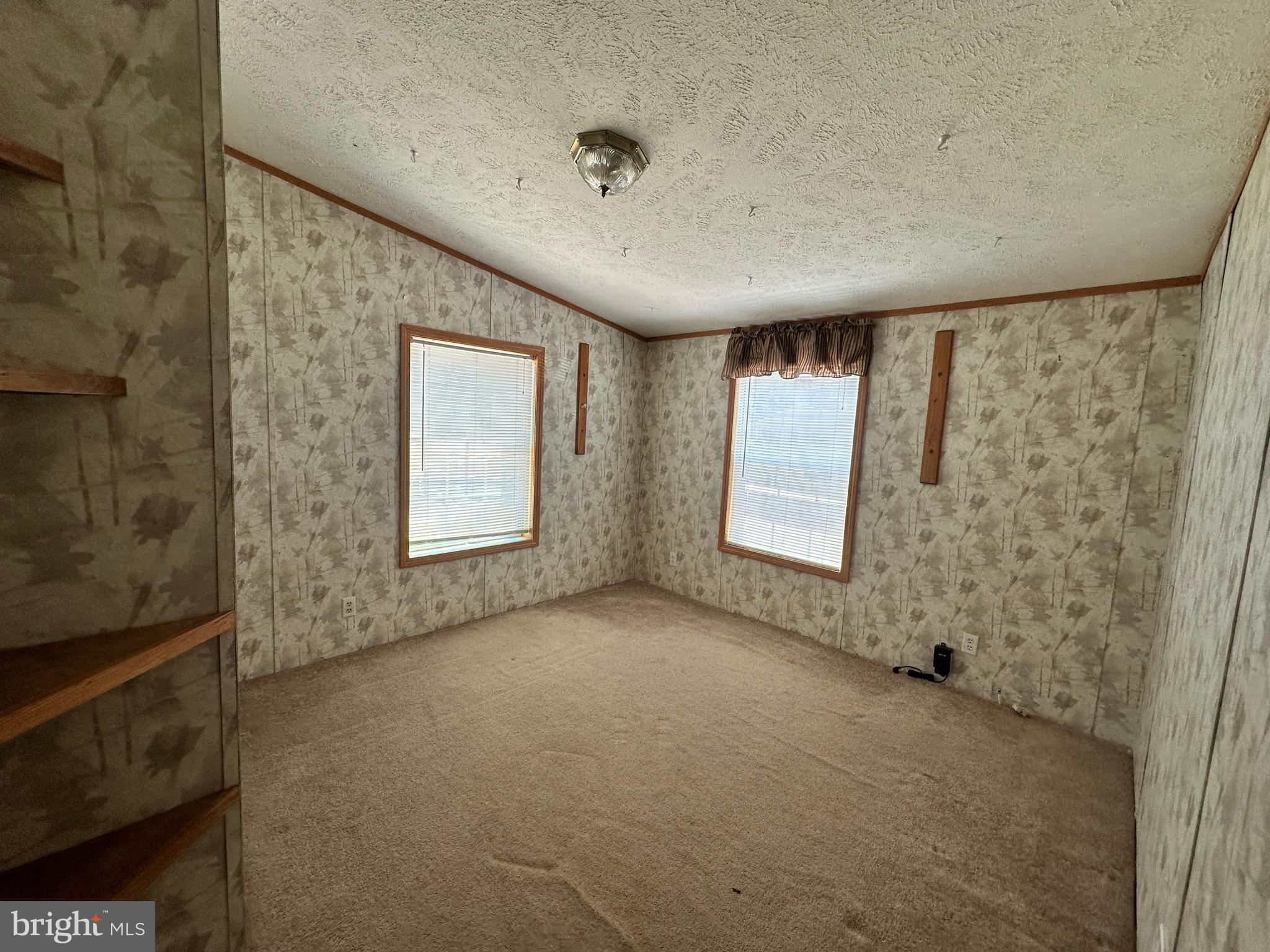 35390 Heron Road Millsboro, DE 19966 - Photo 11 of 25 a view of an empty room with windows