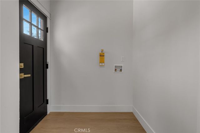 a bedroom with a large bed and a dresser