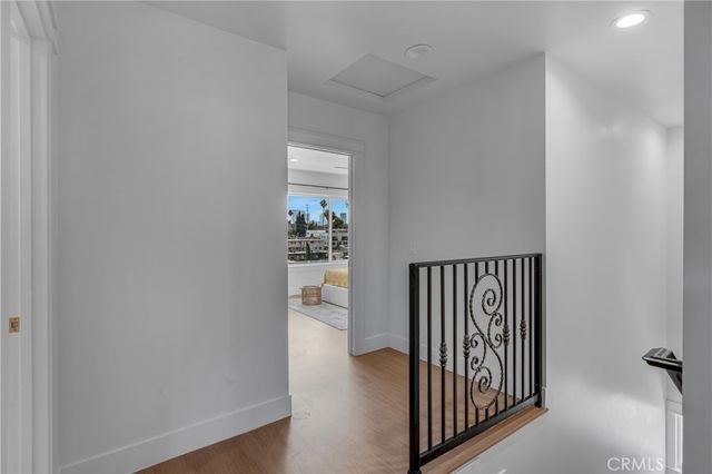 a kitchen with kitchen island granite countertop a sink cabinets and stainless steel appliances