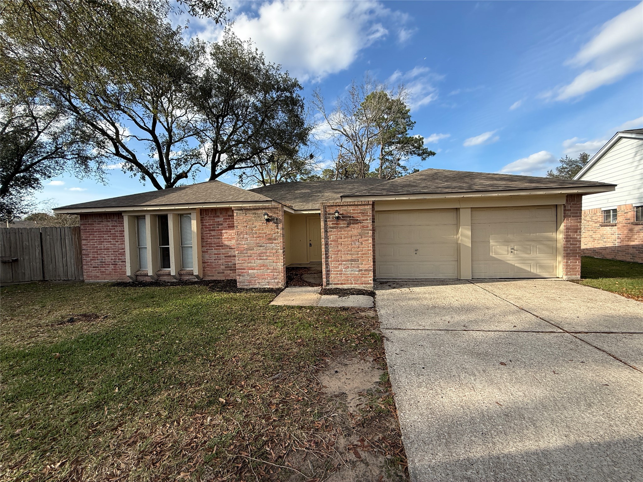 4738 Fleming Downe Lane Spring, TX 77388 - Photo 1 of 14 a front view of a house with a garden and trees