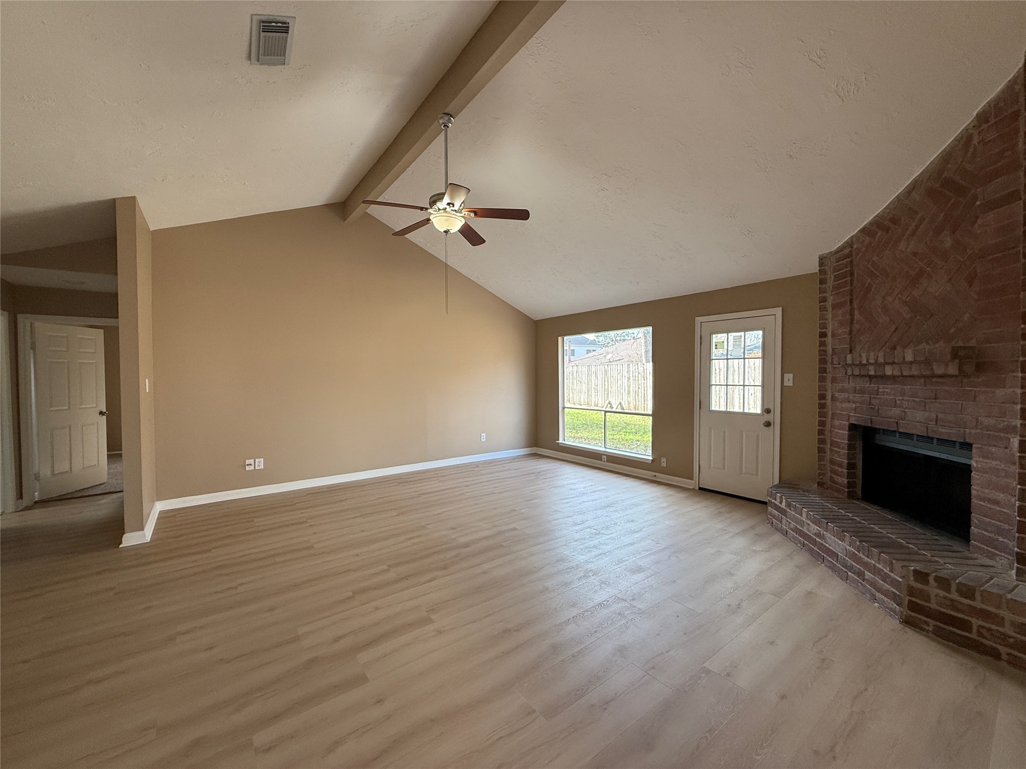 4738 Fleming Downe Lane Spring, TX 77388 - Photo 4 of 14 a view of empty room with wooden floor and fireplace