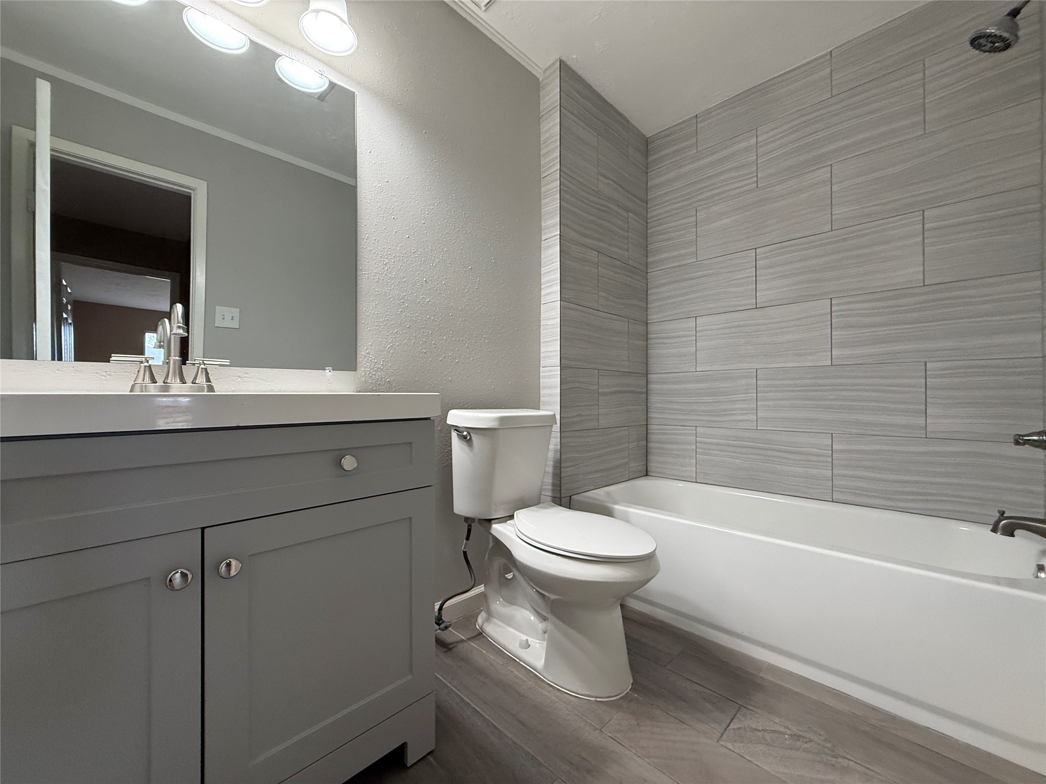 4738 Fleming Downe Lane Spring, TX 77388 - Photo 7 of 14 a bathroom with a toilet a sink a mirror and bathtub