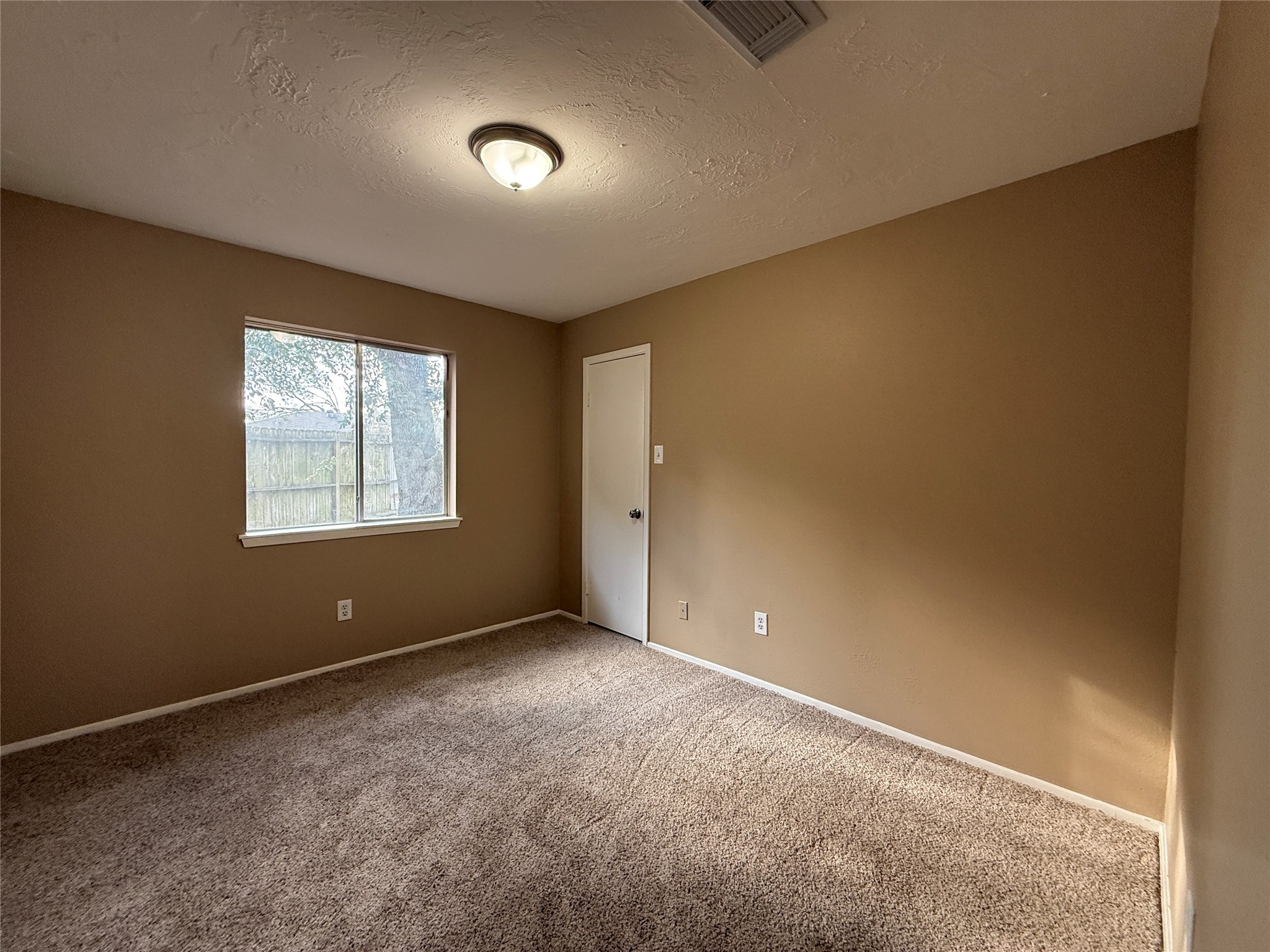 4738 Fleming Downe Lane Spring, TX 77388 - Photo 8 of 14 an empty room with windows