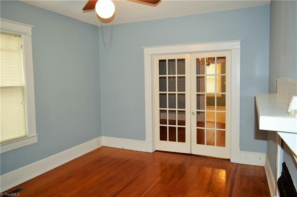 209 East Decatur Street Madison, NC 27025 - Photo 4 of 17 Livingroom with original hardwood floors