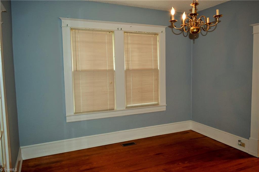 209 East Decatur Street Madison, NC 27025 - Photo 6 of 17 Beautiful hardwoods continue into the dining room