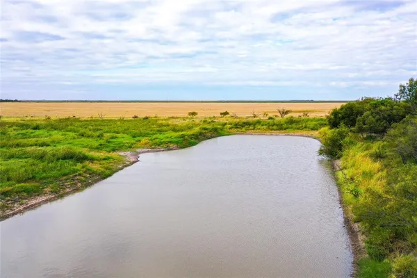 a view of a lake with a big yard